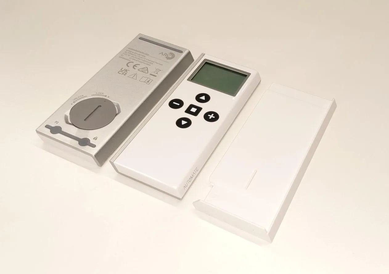 The Push 15 remote with its backplate and wall mount bracket