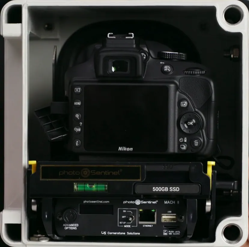Mach II interior — Nikon DSLR mounted on the carriage, with the SSD and controller assembly visible below. The carriage slides out without disturbing the camera position